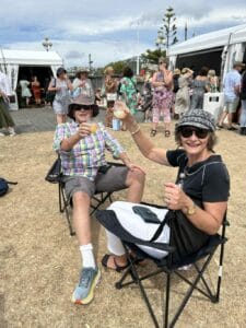 Couple toasting drinks at outdoor festival