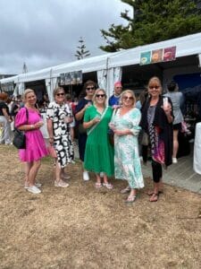 Group of women at outdoor event.