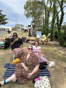 People enjoying picnic in a park.