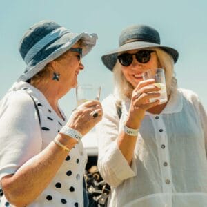 Two women enjoying gin cocktails outdoors
