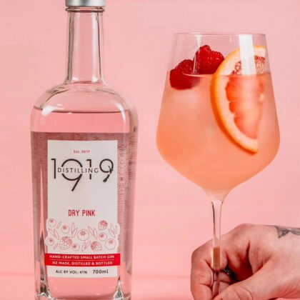 1919 Gin Bottle and cocktail with garnish
