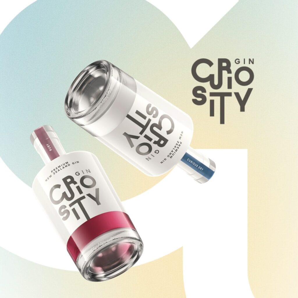 Two Curiosity Gin bottles floating on a colourful background with partial letters CU visibile.