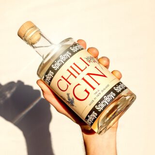 Hand holding a bottle of SpicyBoys Chili Gin